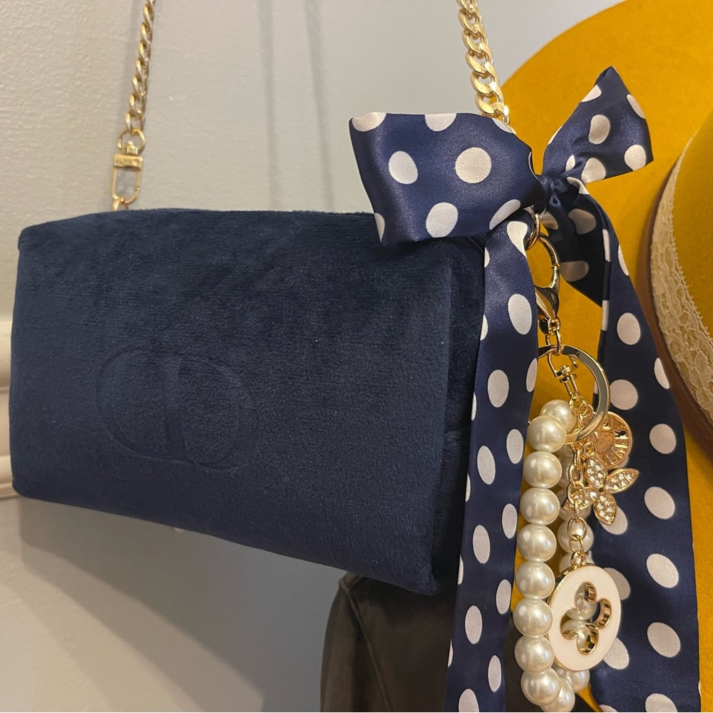 Dior authentic blue velvet & gold purse with pearl & charm keychain.